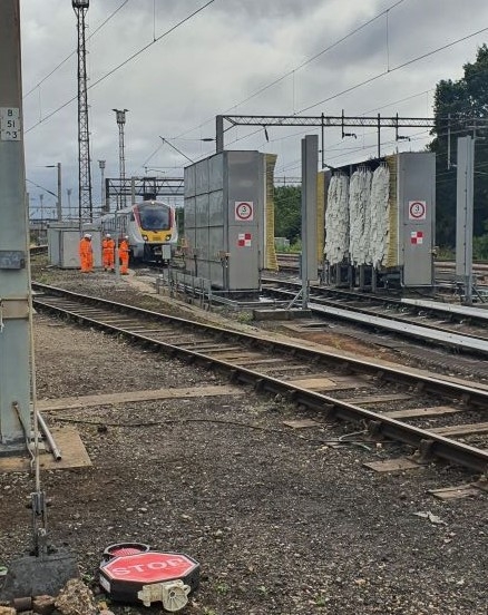 A greater Anglia train approaching the new wash plant at Colchester