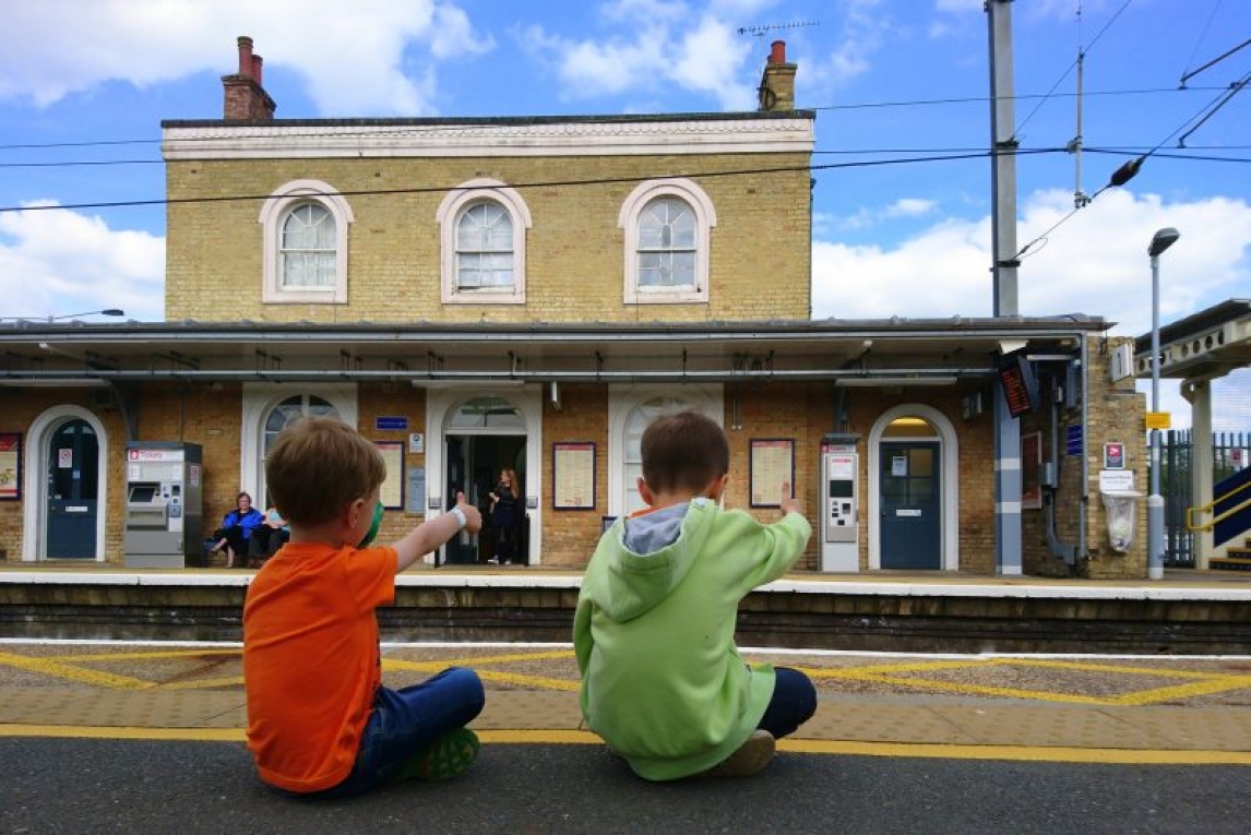 Two kids at the train station