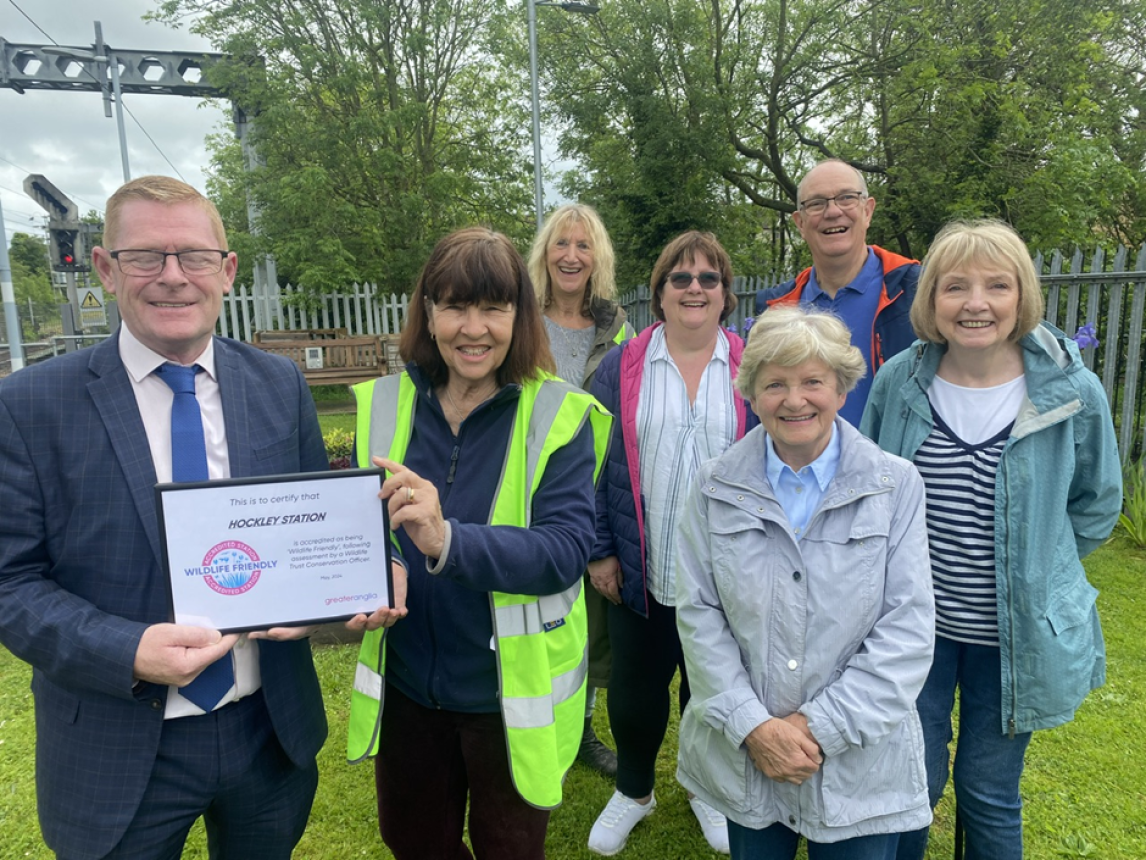 Adopters at Hockley rail station with their Wildlife Friendly Stations accreditation